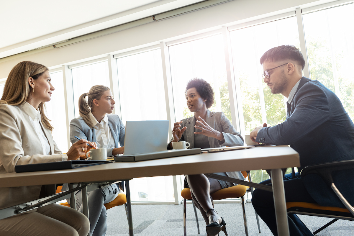 A group of professionals having a meeting in a modern office setting
